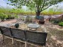 Relaxing backyard featuring a seating area, mature trees, and well-maintained landscaping at 1812 Ivanhoe Way, Las Vegas, NV 89102