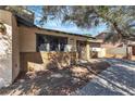 Inviting front entrance with secure gate and well-manicured desert landscaping at 2204 Monterey Ave, Las Vegas, NV 89104