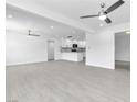 Spacious living room boasts new flooring, modern ceiling fans, recessed lighting and is open to the renovated kitchen at 244 N 19Th St, Las Vegas, NV 89101