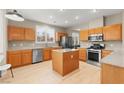 Well-equipped kitchen features stainless steel appliances and central island at 262 Cielito Lindo St, Henderson, NV 89012