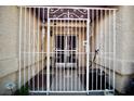 Close-up of the gated and covered front porch, adding security and curb appeal to the property at 2905 Gentilly Ln, Las Vegas, NV 89108