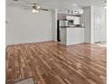 Bright and airy living room boasts hardwood floors, fireplace and stainless steel appliances at 4050 Pacific Harbors Dr # 229, Las Vegas, NV 89121