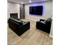 Living room features a large TV and a cozy seating arrangement at 4083 Nook Way # A, Las Vegas, NV 89103