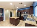 A well-equipped kitchen with stainless steel appliances and granite countertops at 6636 Brent Scott St, North Las Vegas, NV 89086