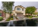 Charming two-story home with a well-maintained lawn, beautiful landscaping, and an attached two-car garage at 7553 Old Compton St, Las Vegas, NV 89166