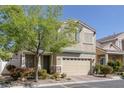 Attractive home with tidy landscaping, a two-car garage, and a welcoming entrance at 7598 Alexander Hills St, Las Vegas, NV 89139