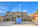 New construction home featuring a three-car garage and modern design under a blue sky at 8 Rue Du Ville Way, Henderson, NV 89011
