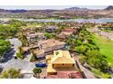 Aerial view of a home under construction with a great view of the lake and golf course in a desert community at 8 Rue Du Ville Way, Henderson, NV 89011
