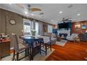 Open-concept dining area features a round table, seating for four, and hardwood flooring at 8600 W Charleston Blvd # 2078, Las Vegas, NV 89117