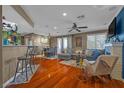 Spacious living room showcases hardwood floors, fireplace, ceiling fan and comfortable seating at 8600 W Charleston Blvd # 2078, Las Vegas, NV 89117