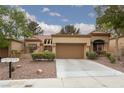 Inviting single-story home features a paved driveway and a low-maintenance landscaped yard at 9533 Yucca Blossom Dr, Las Vegas, NV 89134