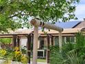 Stylish outdoor structure, wood posts, and neutral awning, offering a shaded retreat and enhancing outdoor living space at 1812 Ivanhoe Way, Las Vegas, NV 89102