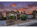 Attractive single-Gathering house with a two-car garage, xeriscaping, and a beautiful sunset backdrop at 10513 Shanna Trellis Ave, Las Vegas, NV 89144