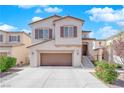 Inviting two-story home boasts a spacious garage, neutral-toned facade, manicured greenery, and an accessible front entrance at 10973 Sardinia Sands Dr, Las Vegas, NV 89141