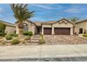 Inviting front of home with a paver driveway and well-maintained landscaping at 1342 Calle Calma, Henderson, NV 89012