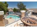 Inviting outdoor oasis with pool, rock feature and nearby deck, perfect for entertaining at 1922 Pyle, Las Vegas, NV 89183