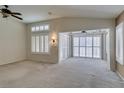 Spacious living room features a vaulted ceiling, neutral walls, and white plantation shutters at 2007 High Mesa Dr, Henderson, NV 89012