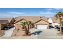 A charming single-story home featuring desert landscaping, a two-car garage and a well-maintained front yard at 209 Eucalyptus Ln, Mesquite, NV 89027