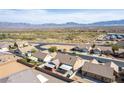 An aerial view showcasing a residential neighborhood with mountain views in the distance at 209 Eucalyptus Ln, Mesquite, NV 89027