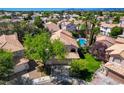 Expansive aerial shot showcasing the property, backyard pool, and surrounding neighborhood at 2401 Rice Flower Cir, Las Vegas, NV 89134
