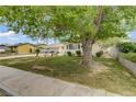 Well-maintained home with a large tree offering shade and curb appeal at 2706 Colanthe Ave, Las Vegas, NV 89102