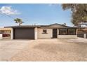 Front exterior featuring a well-maintained, single-story home with a driveway and desert-style landscaping at 2958 Al De La St, Las Vegas, NV 89146