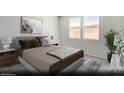 Serene main bedroom with large windows, neutral decor, and comfortable furnishings at 3044 Dagny St # Lot 7, Las Vegas, NV 89121