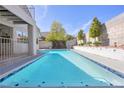 Sparkling pool surrounded by mature landscaping, perfect for relaxation and outdoor enjoyment at 3329 Buffalo Narrows Cir, Las Vegas, NV 89129