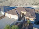 Aerial view of home showing the tile roof and desert landscaping at 3439 Cottage Canyon St, Laughlin, NV 89029