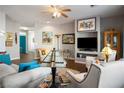 Comfortable living room featuring neutral tones, stylish furnishings, and an entertainment center at 3491 Cottage Thistle Dr, Laughlin, NV 89029
