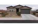 Charming single-story home with a two-car garage and low-maintenance desert landscaping at 3530 E Moffat Ave, Pahrump, NV 89061
