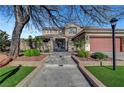 Inviting two-story home with a well-maintained lawn and decorative landscaping at 4108 Freel Peak Ct, Las Vegas, NV 89129