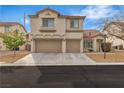 Charming two-story home with a two-car garage, well-maintained landscaping, and a welcoming entrance at 4247 Jordanville St, Las Vegas, NV 89129
