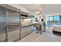 This condo features a modern kitchen with stainless steel appliances, a breakfast bar and open living space at 4381 W Flamingo Rd # 1609, Las Vegas, NV 89103