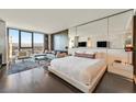 This condo's main bedroom features gorgeous city views, wood floors, and a seating area to enjoy the vistas at 4381 W Flamingo Rd # 1609, Las Vegas, NV 89103