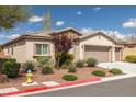 Attractive single-story house showcasing desert landscaping, stone details, and a functional three-car garage at 5224 E San Palo Dr, Pahrump, NV 89061