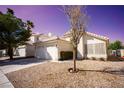 Charming single-story home featuring a two-car garage, low maintenance landscaping, and a tile roof at 5260 Del Lago Dr, Las Vegas, NV 89130