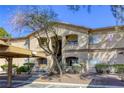 Charming exterior view of the condo complex featuring a mix of desert landscaping and reserved parking at 5751 E Hacienda Ave # 243, Las Vegas, NV 89122