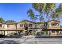 Exterior view of the condo complex with covered parking and ample parking spaces at 5751 E Hacienda Ave # 243, Las Vegas, NV 89122