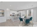 Bright kitchen featuring granite countertops, stainless steel appliances, and an adjacent dining area at 6276 Desert Orchid Way, Las Vegas, NV 89141