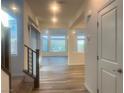 Bright entryway with hardwood flooring and staircase leading to the upper level of the home at 629 Soaring Wings Ave, Las Vegas, NV 89183