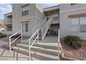 Multi-Gathering residential building with stairs leading up to the units at 6800 E Lake Mead Blvd # 1033, Las Vegas, NV 89156