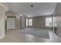 Inviting living room with tile floors, neutral walls, a fireplace, and bright windows at 8121 Heavenly Star Cir, Las Vegas, NV 89128