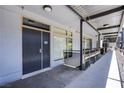 Modern building hallway with a walkway, unit entrances, and contemporary design elements at 8925 W Flamingo Rd # 228, Las Vegas, NV 89147