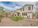 Charming backyard featuring low-maintenance landscaping and a small patio area, perfect for relaxing outdoors at 10808 Wallflower Ave, Las Vegas, NV 89135