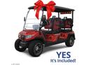 Included golf cart with red bow, black canopy and seating, along with 