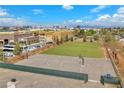 Image of a playground featuring a basketball court, track and field, and recreational facilities with buildings in the background at 2130 E Maule Ave, Las Vegas, NV 89119