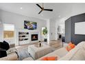 Bright and airy living room with fireplace, ceiling fan, and modern finishes at 228 Mchenry St, Las Vegas, NV 89144
