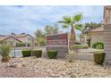 Las Palomas community entrance with manicured landscaping and decorative stone signage at 4808 Fiesta Lakes St, Las Vegas, NV 89130