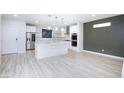 New kitchen features stainless steel appliances, a center island, and marble countertops at 10631 Sariah Skye Ave, Las Vegas, NV 89166